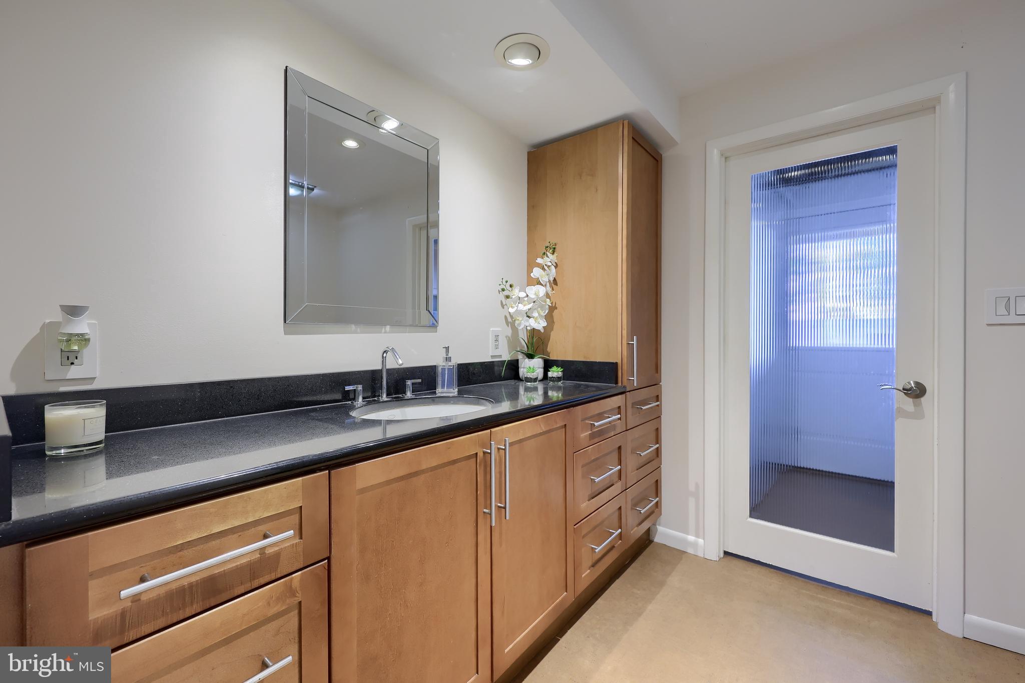 670 Shultz Road Washington Boro, PA 17582 - Photo 39 of 79 a bathroom with a granite countertop sink and a mirror