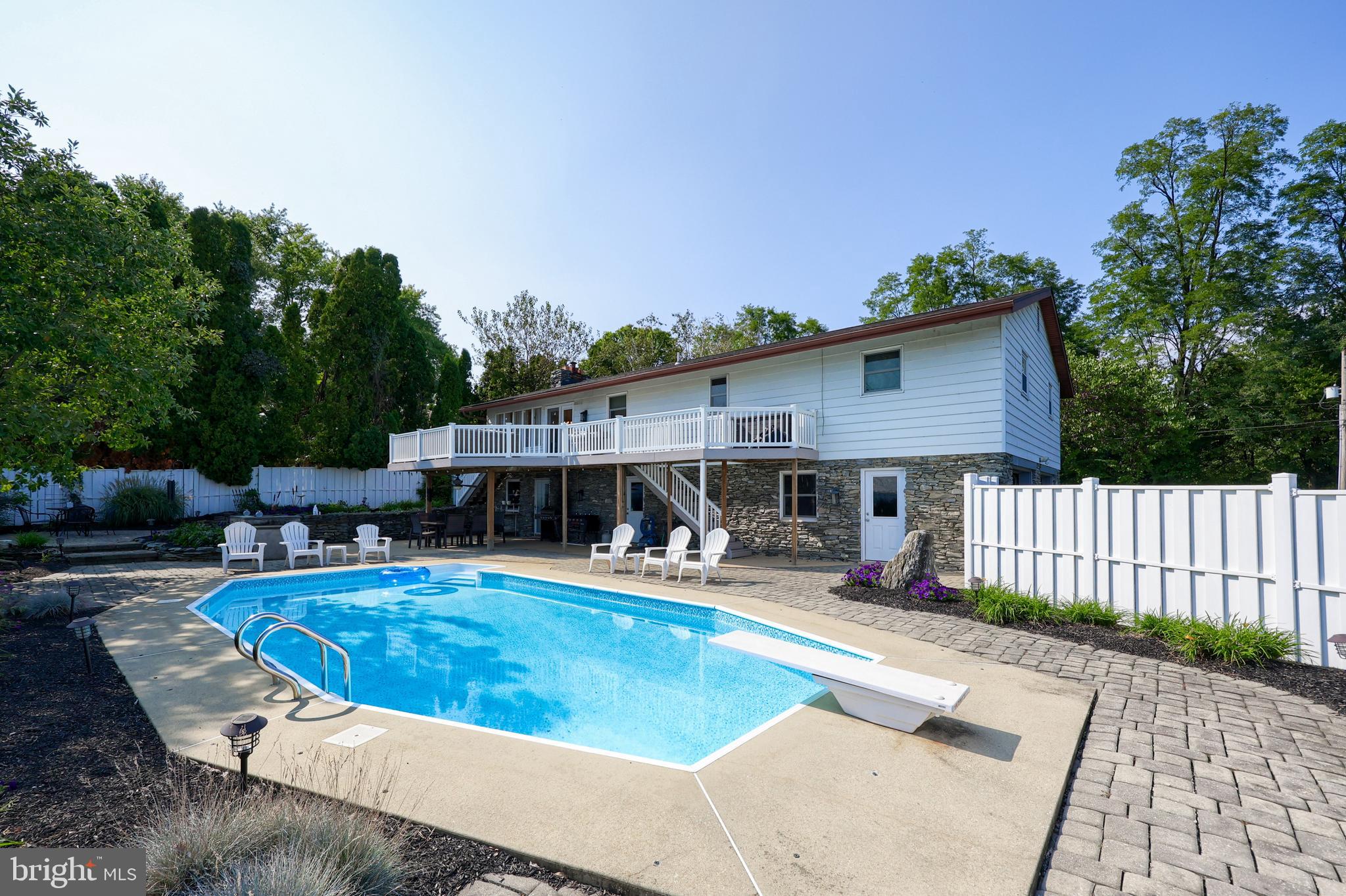 670 Shultz Road Washington Boro, PA 17582 - Photo 42 of 79 a view of a house with backyard swimming pool and sitting area