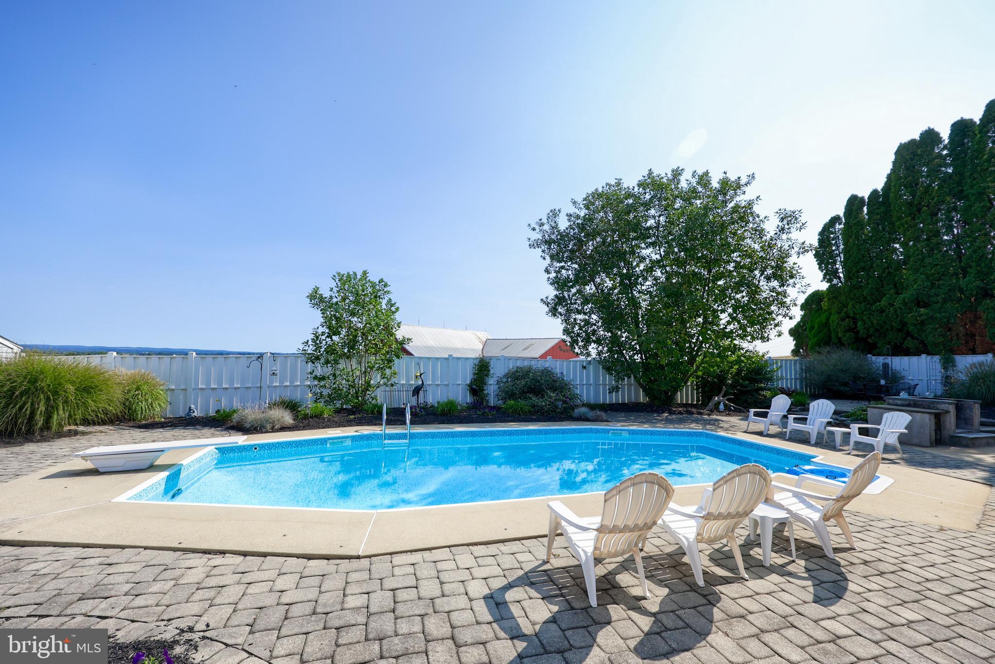 670 Shultz Road Washington Boro, PA 17582 - Photo 43 of 79 a view of a swimming pool with a patio
