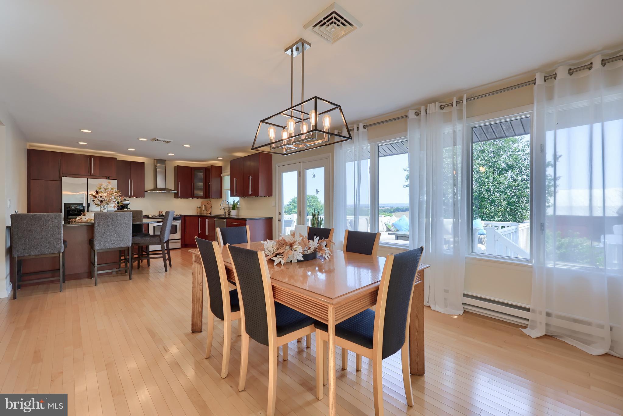 670 Shultz Road Washington Boro, PA 17582 - Photo 7 of 79 a view of a dining room with furniture window and wooden floor