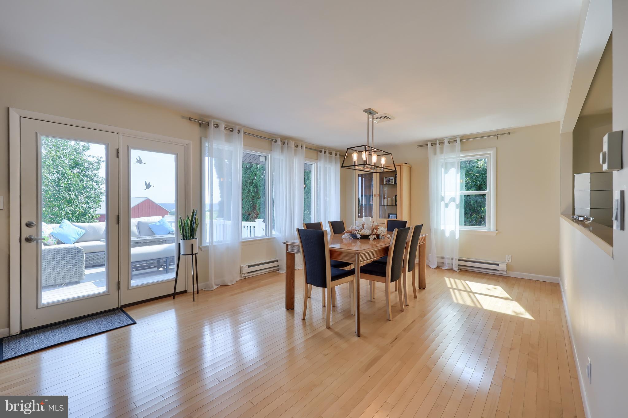 670 Shultz Road Washington Boro, PA 17582 - Photo 8 of 79 a view of a dining room with furniture and wooden floor