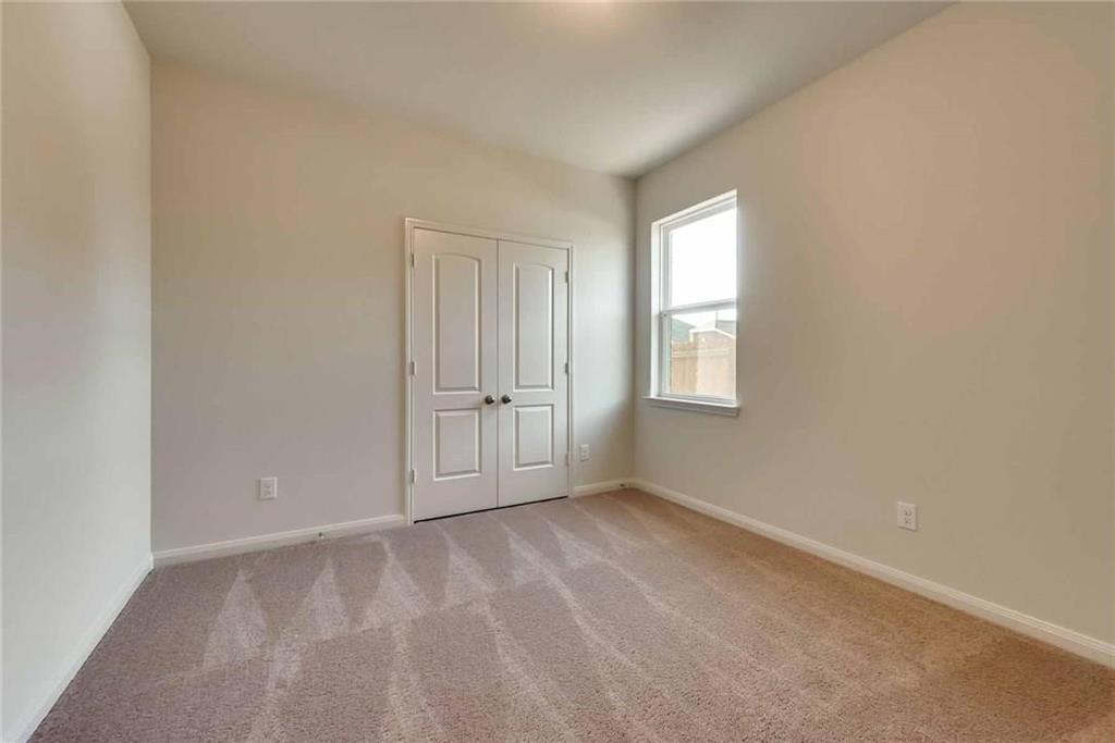 4720 Merchant Trail Denton, TX 76207 - Photo 11 of 13 a view of an empty room with a window