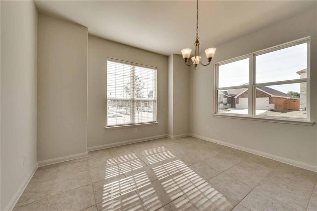 4720 Merchant Trail Denton, TX 76207 - Photo 4 of 13 a view of an empty room with a window