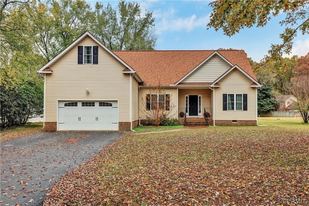 4112 Hidden Valley Road Chester, VA 23831 - Photo 1 of 29 a front view of a house with a garden