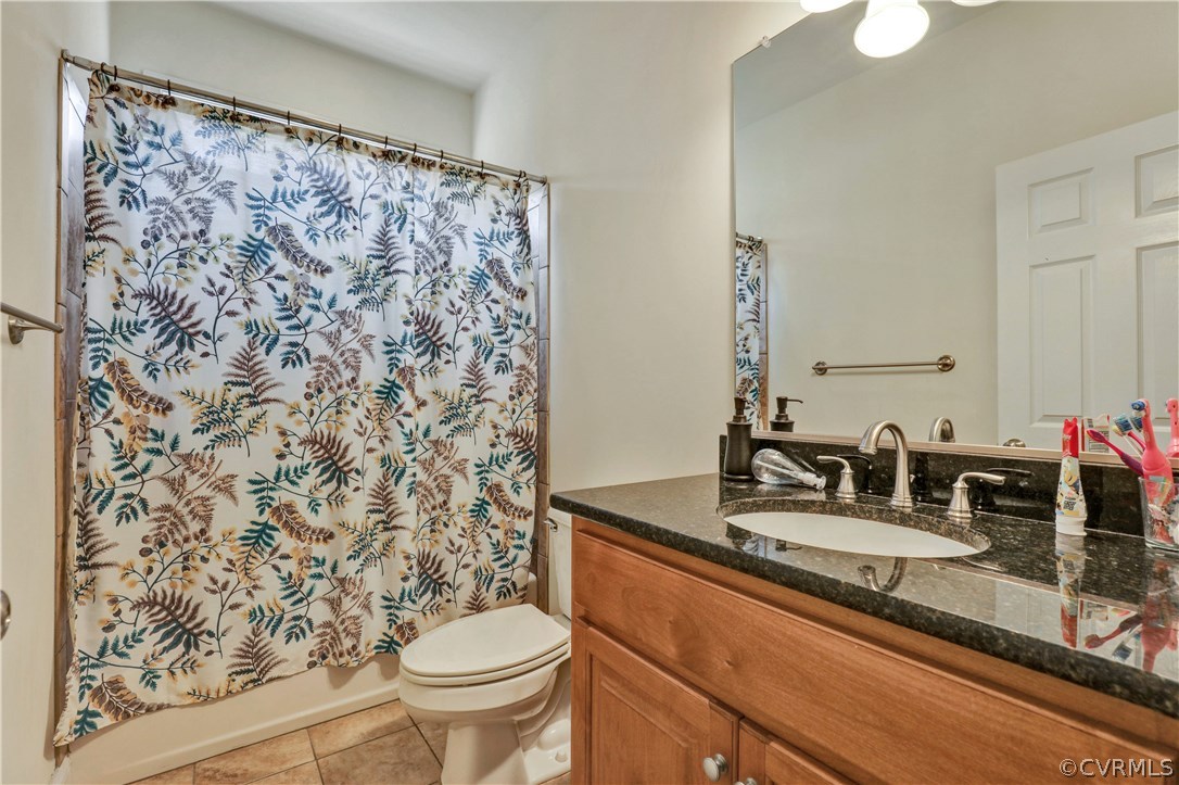 4112 Hidden Valley Road Chester, VA 23831 - Photo 19 of 29 a bathroom with a sink toilet and shower