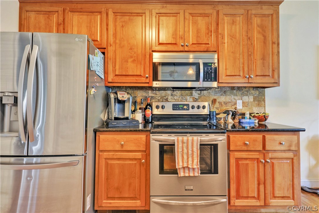 4112 Hidden Valley Road Chester, VA 23831 - Photo 9 of 29 a kitchen with stainless steel appliances granite countertop a refrigerator and microwave