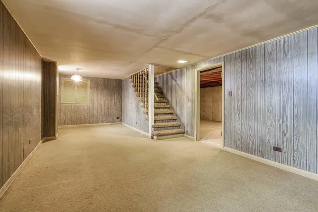 a view of an empty room with stairs