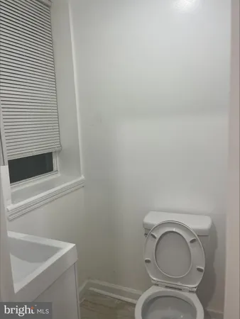 a bathroom with a toilet and a sink
