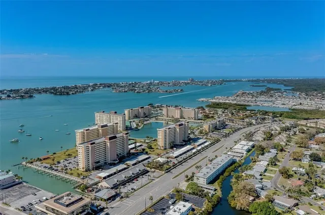 an aerial view of a city with lawn chairs