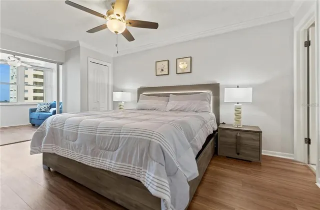 a bedroom with a bed and a night stand