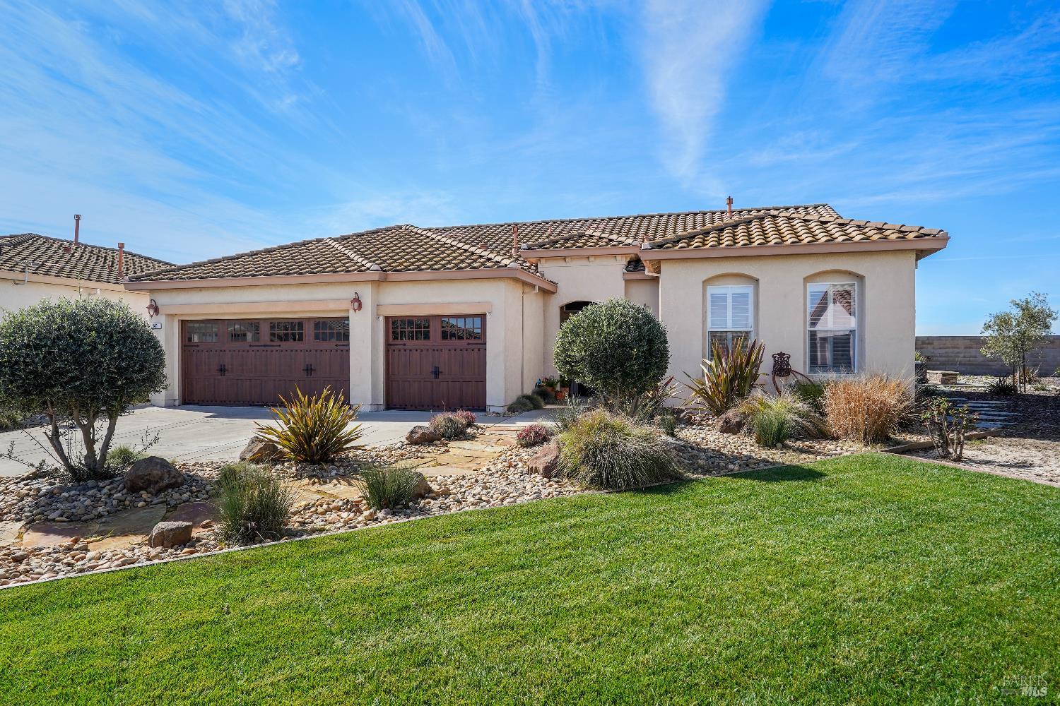 341 Watson Hollow Drive Rio Vista, CA 94571 - Photo 1 of 38 a front view of a house with a garden and plants