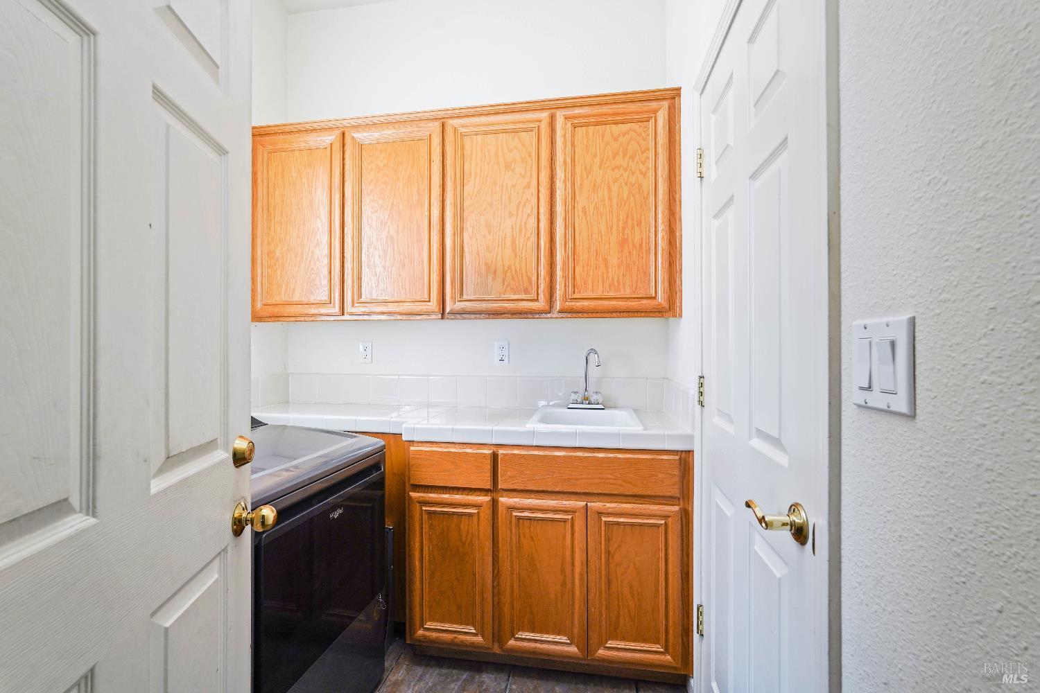 341 Watson Hollow Drive Rio Vista, CA 94571 - Photo 10 of 38 a utility room with a sink a washer and dryer