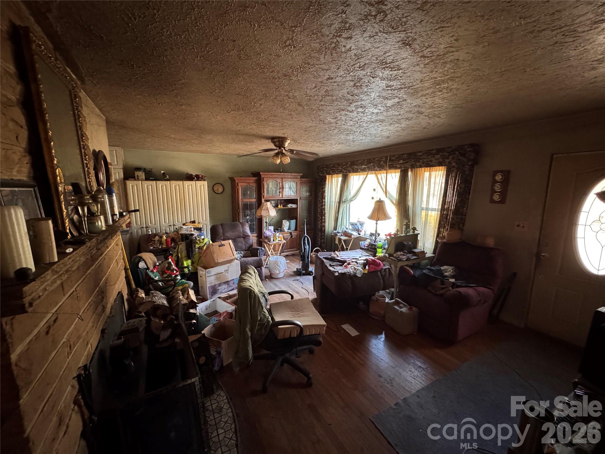 2409 Kanuga Road Hendersonville, NC 28739 - Photo 2 of 7 a living room with lots of furniture and a large window