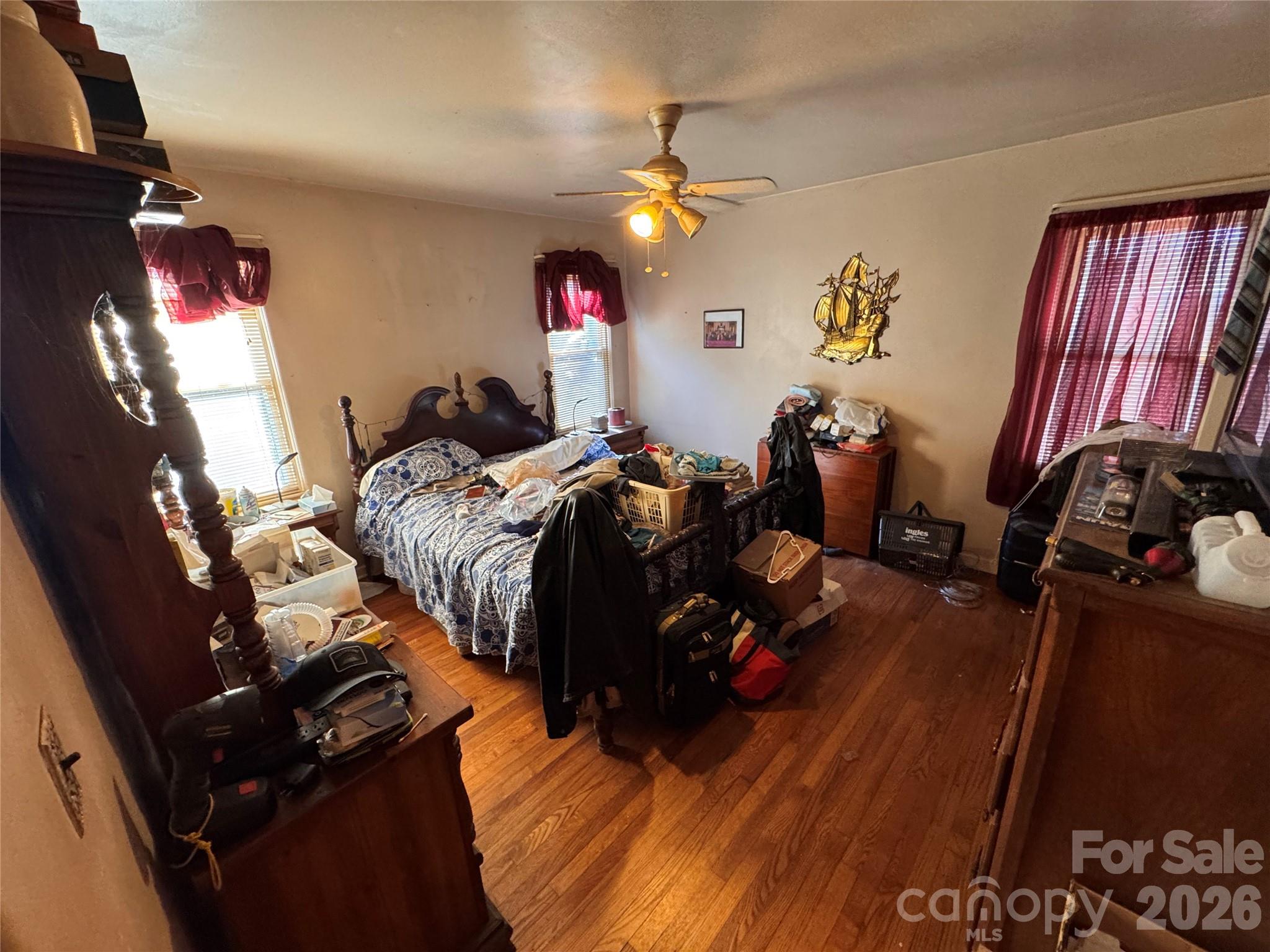 2409 Kanuga Road Hendersonville, NC 28739 - Photo 5 of 7 a bed room with a bed furniture and a flat screen tv