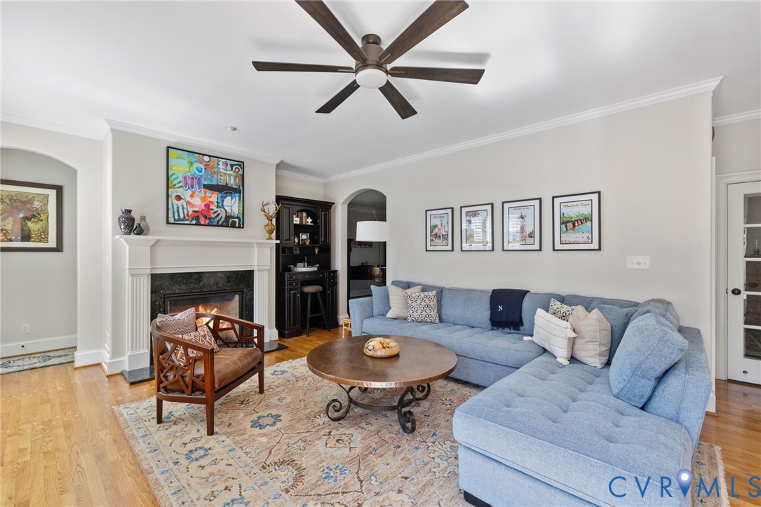 8947 Cherokee Road Richmond, VA 23235 - Photo 19 of 45 a living room with furniture and a fireplace