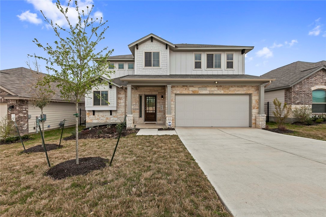 132 Caney Cove Leander, TX 78641 - Photo 1 of 1 a front view of a house with garden