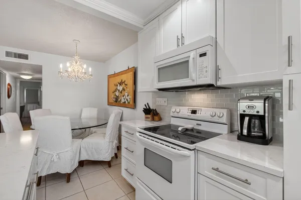 a kitchen with cabinets and appliances