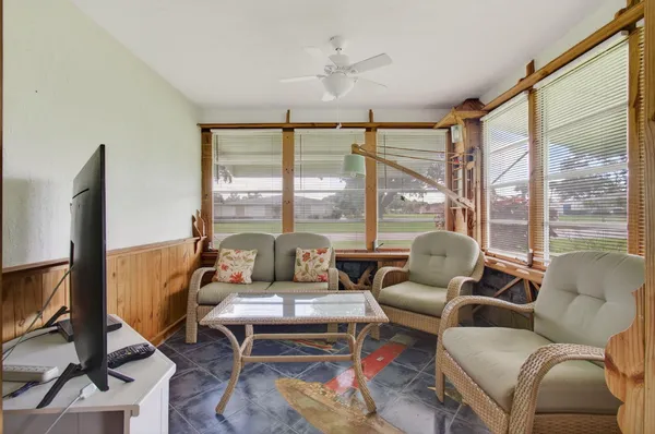 a living room with furniture and a window
