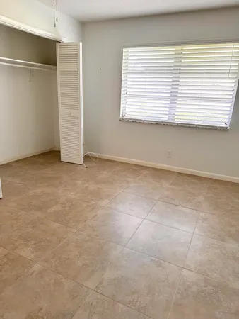 a white toilet sitting next to a bathroom