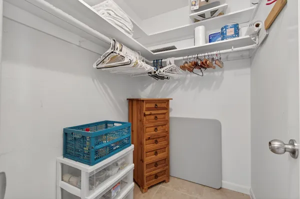 a bathroom with a toilet a sink and glass door