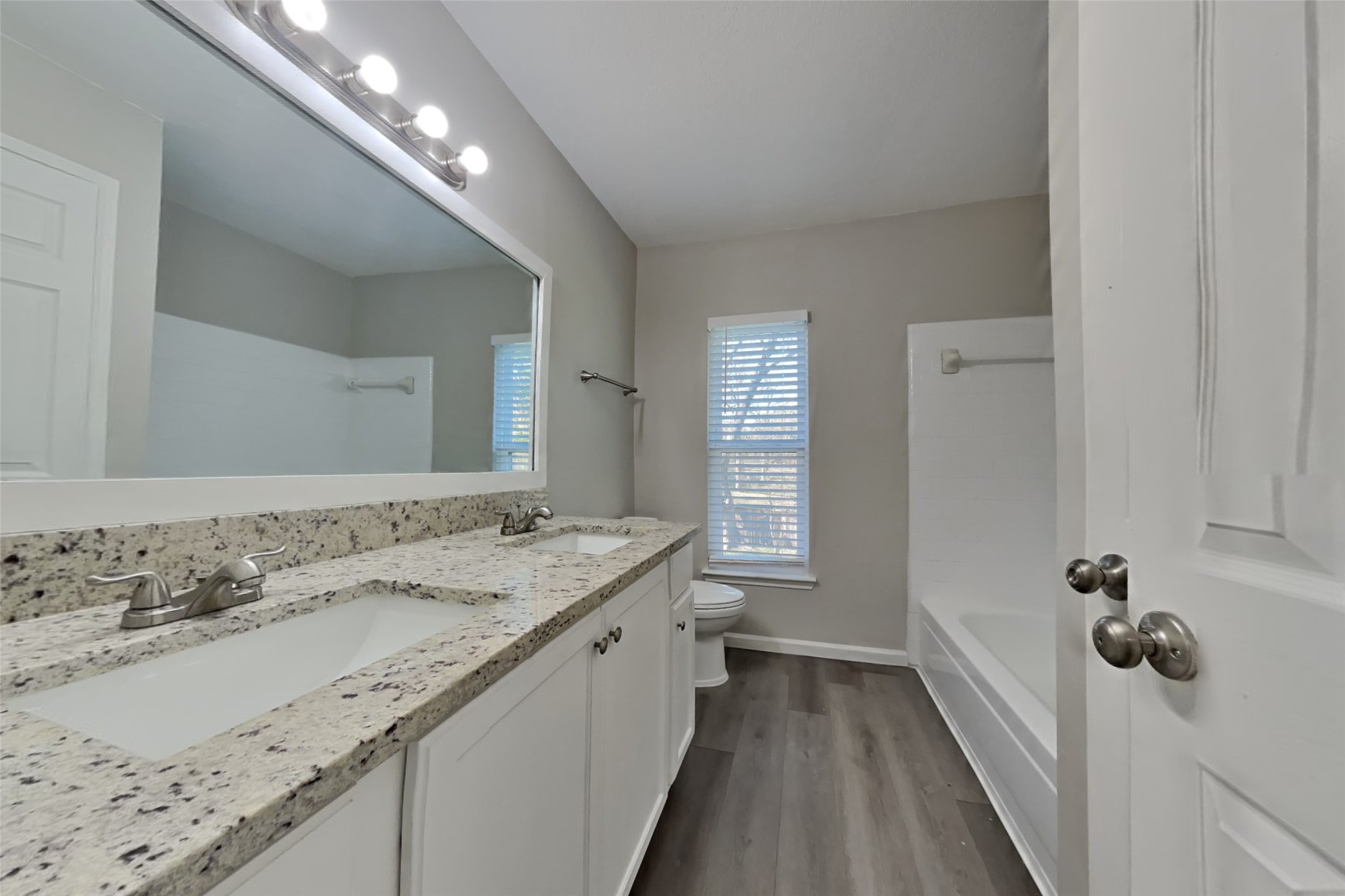 514 Rams Bottom Court Spring, TX 77388 - Photo 16 of 19 a bathroom with a granite countertop double vanity sink and a mirror