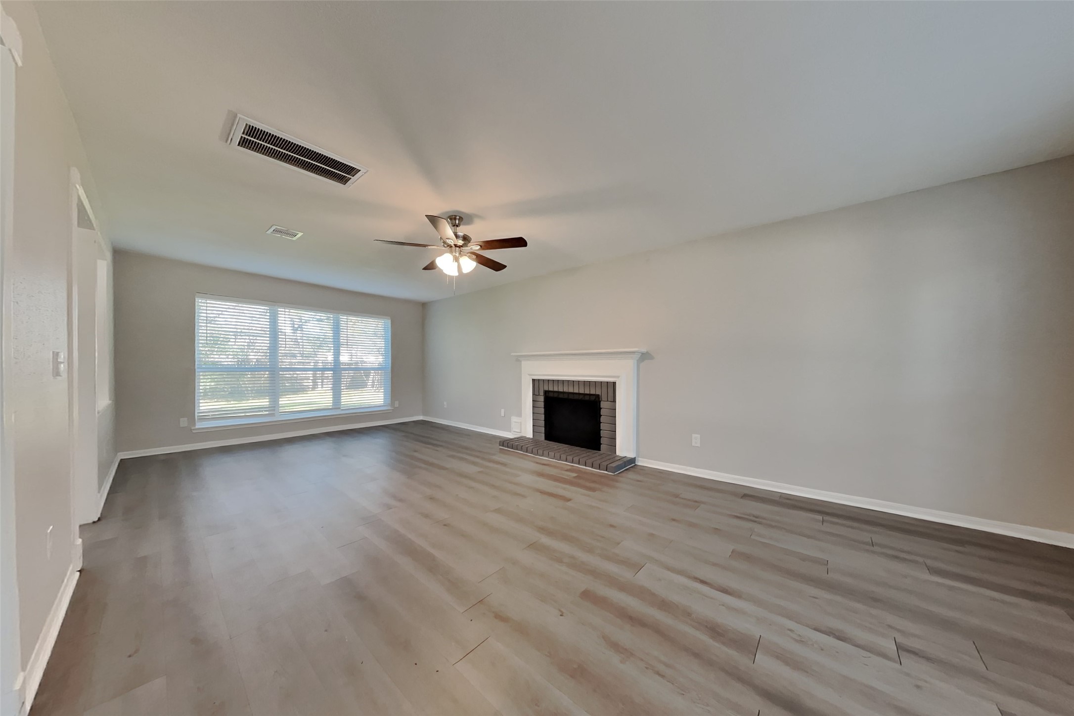 514 Rams Bottom Court Spring, TX 77388 - Photo 3 of 19 a view of an empty room with wooden floor and a window