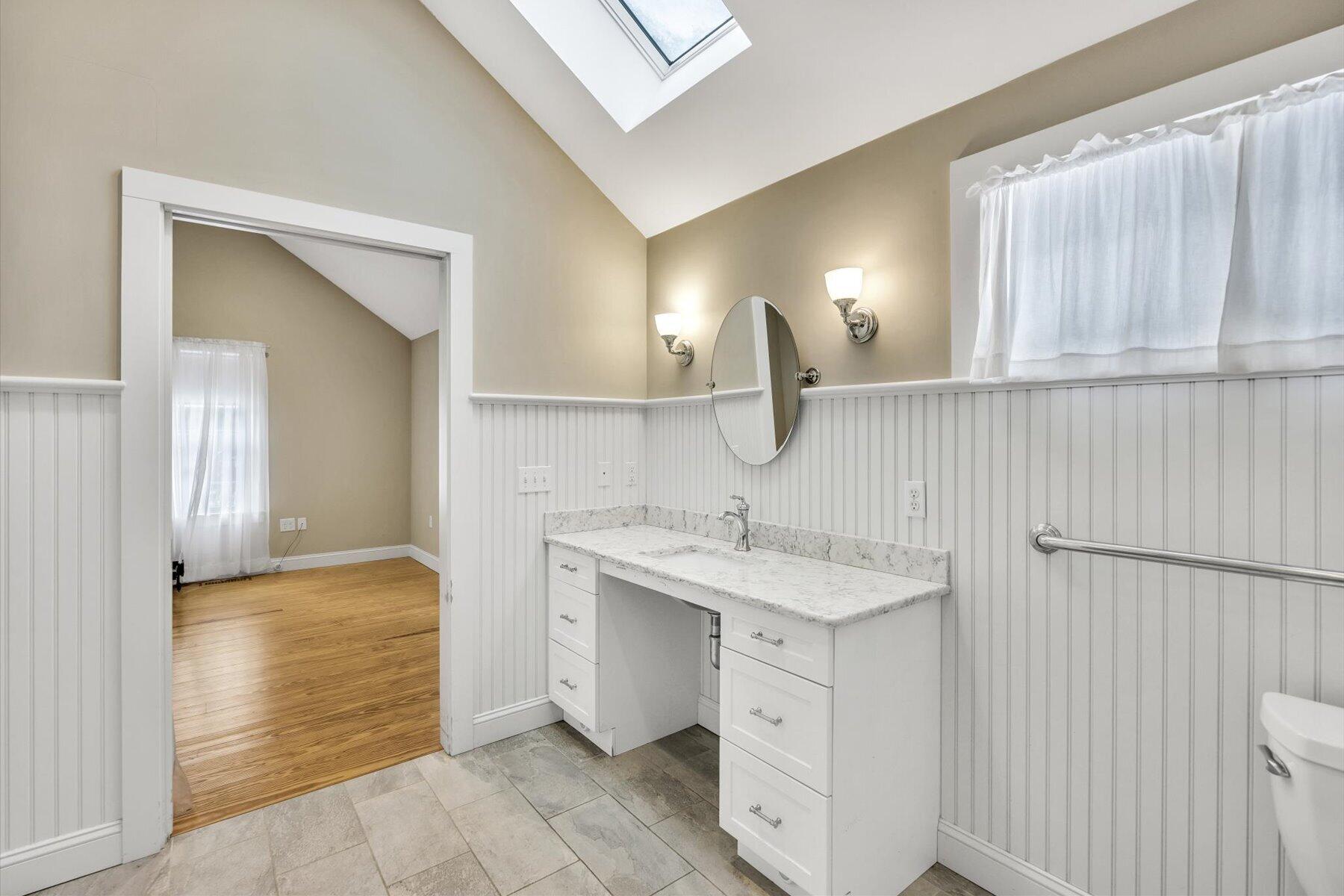 85 Clamshell Cove Road Cotuit, MA 02635 - Photo 18 of 46 a bathroom with a sink and a mirror