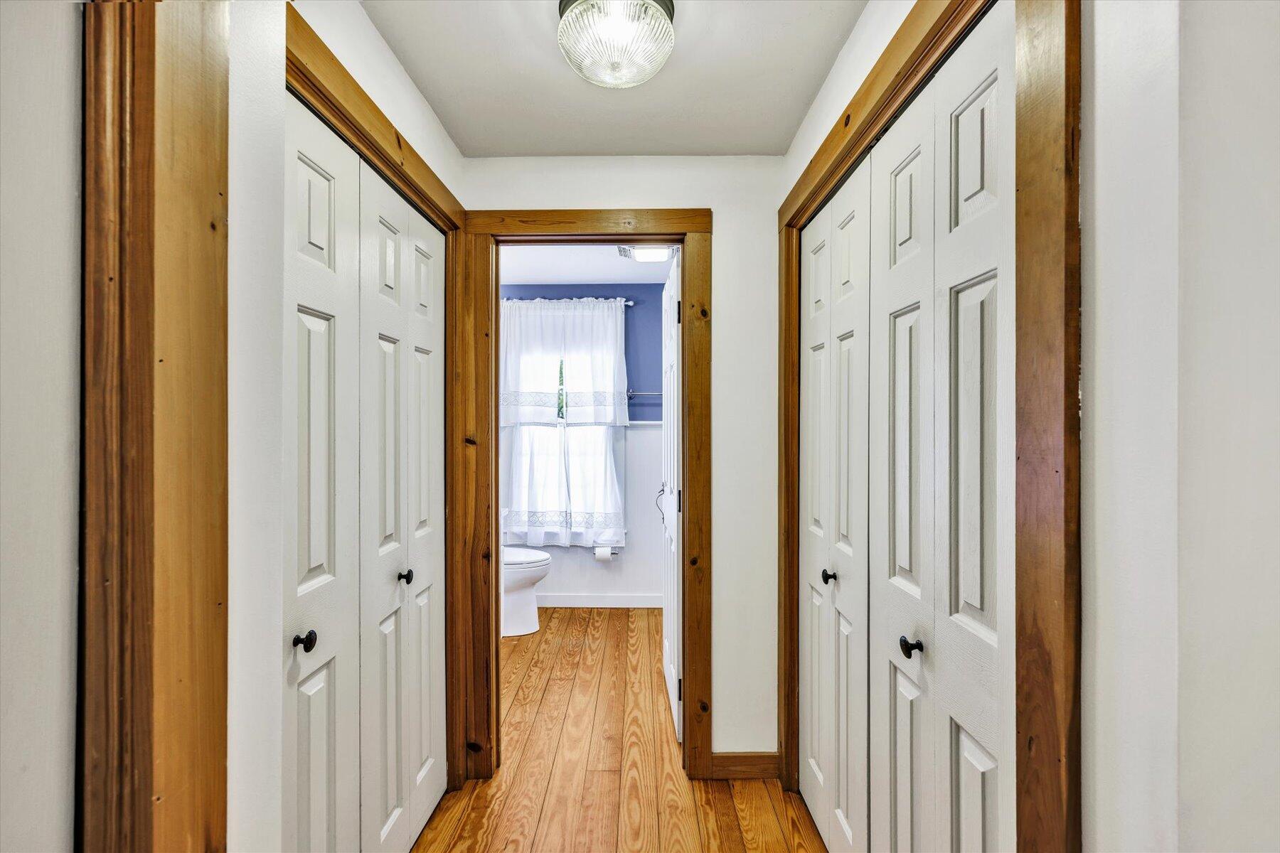 85 Clamshell Cove Road Cotuit, MA 02635 - Photo 26 of 46 a view of a hallway with wooden floor and staircase