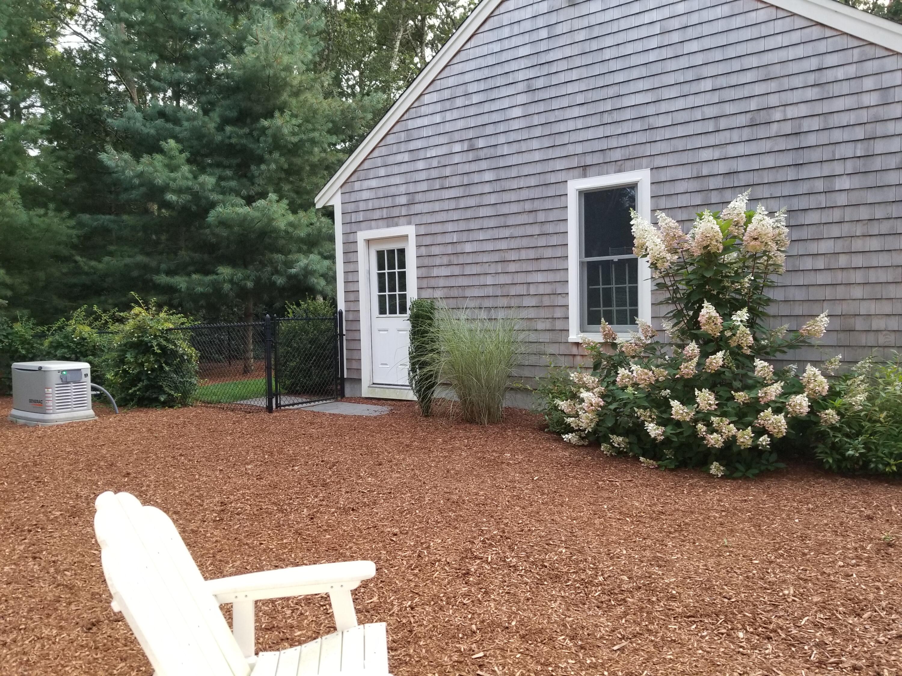 85 Clamshell Cove Road Cotuit, MA 02635 - Photo 31 of 46 Side with generator