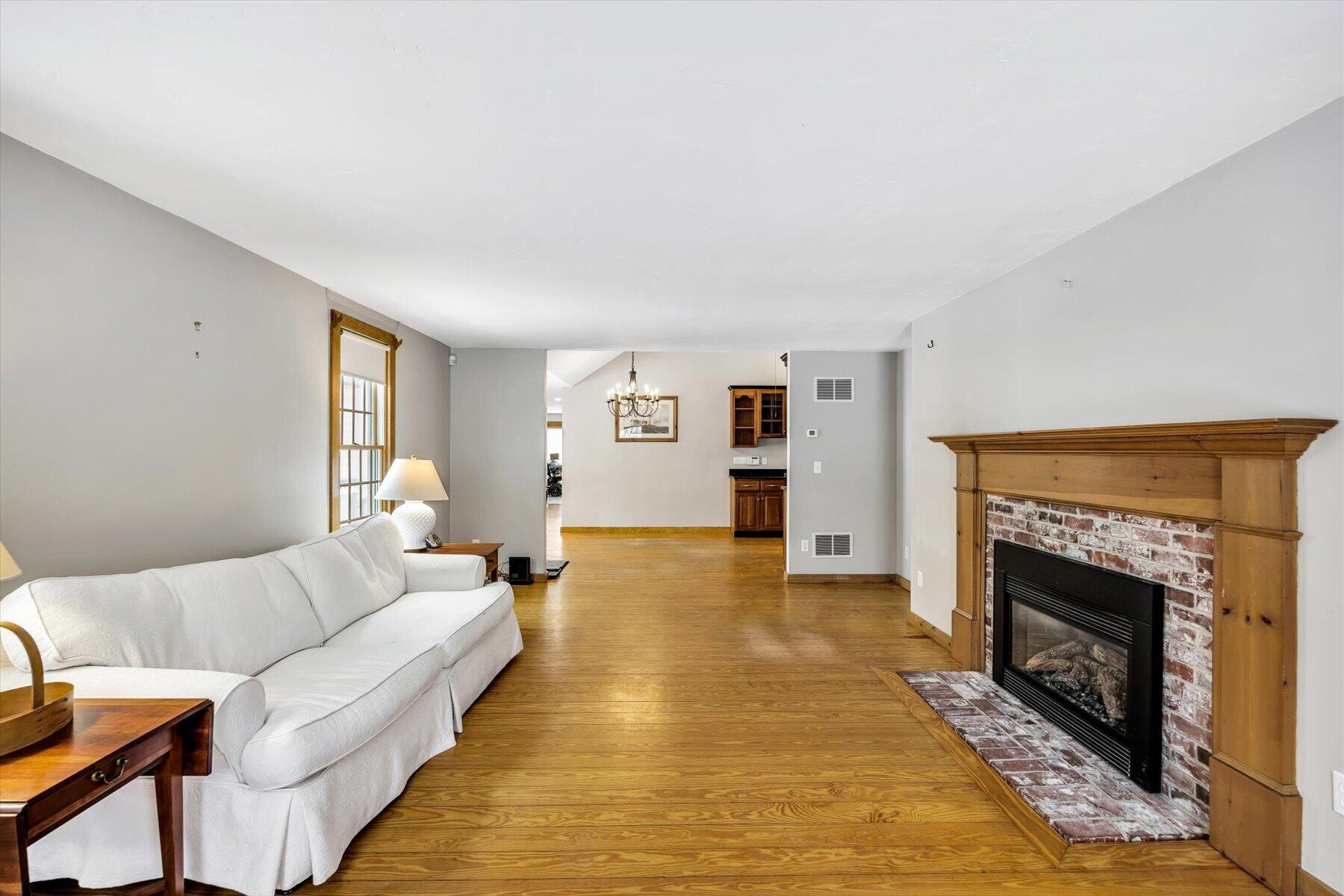 85 Clamshell Cove Road Cotuit, MA 02635 - Photo 10 of 46 Living - couch fireplace