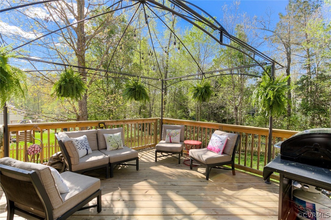 15201 Powell Grove Road Midlothian, VA 23112 - Photo 23 of 27 a roof deck with a table and chairs