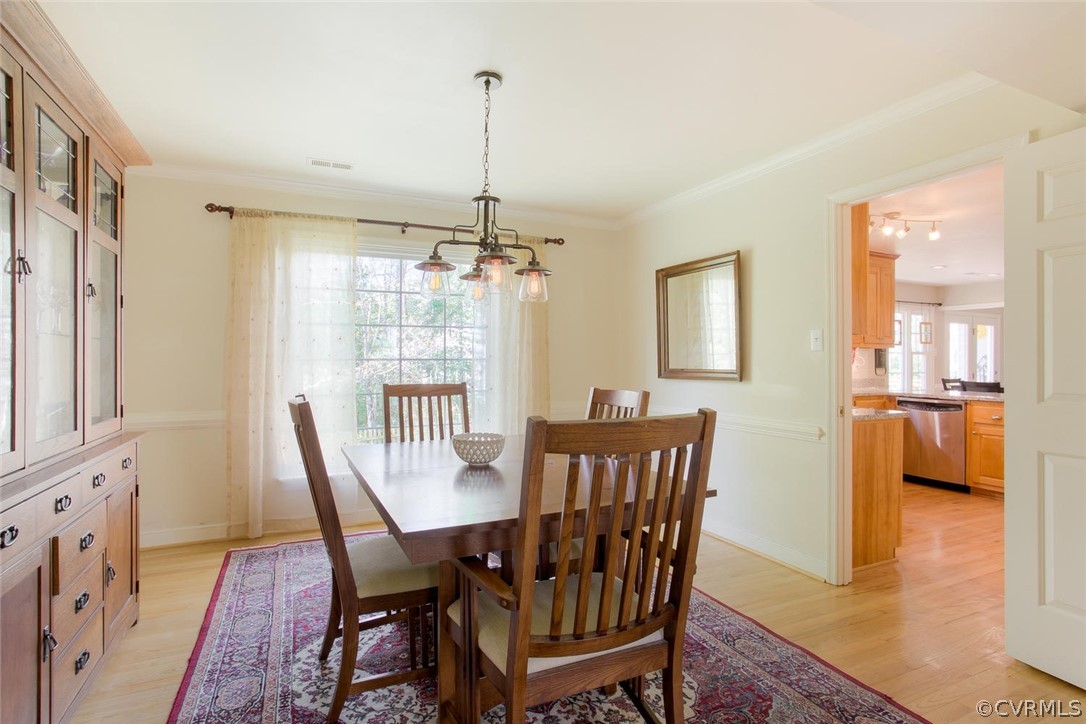 15201 Powell Grove Road Midlothian, VA 23112 - Photo 5 of 27 a view of a dining room with furniture window and wooden floor