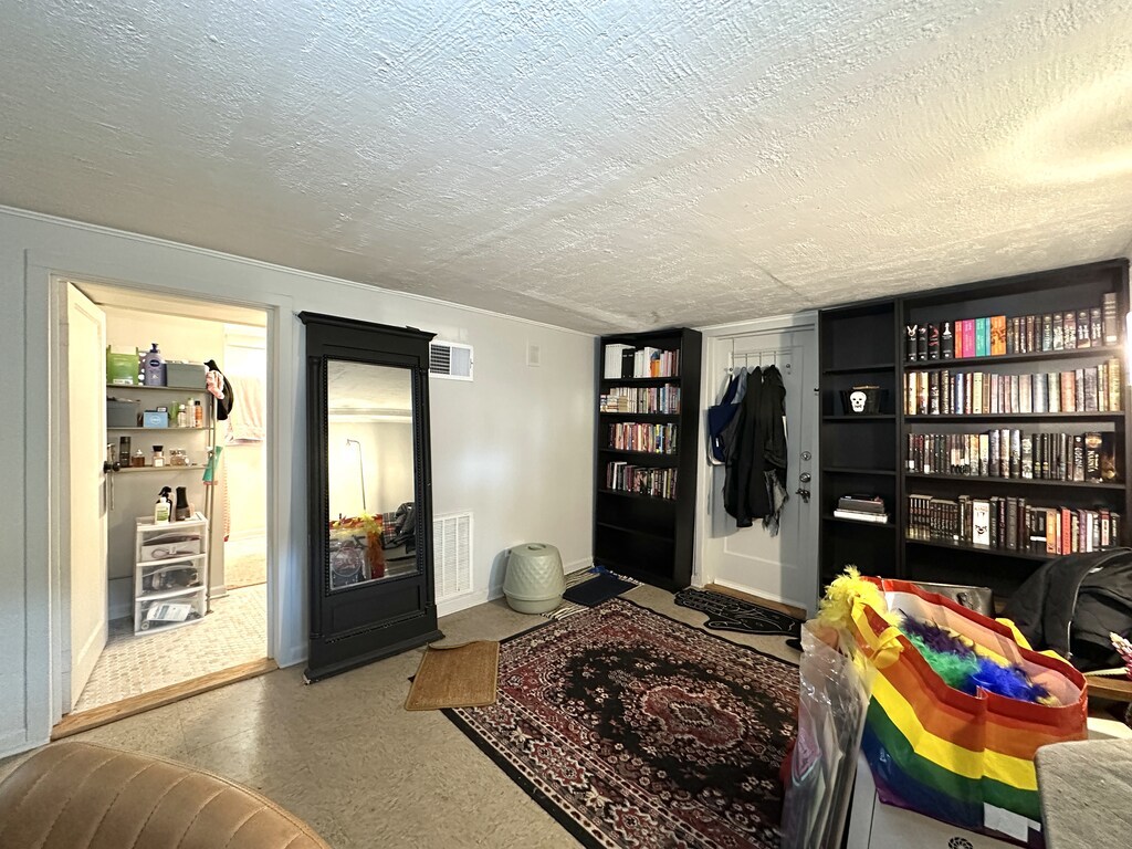 5701 North Keystone Avenue, Unit GDN Chicago, IL 60646 - Photo 13 of 20 a bedroom with a bed a dresser and book shelf