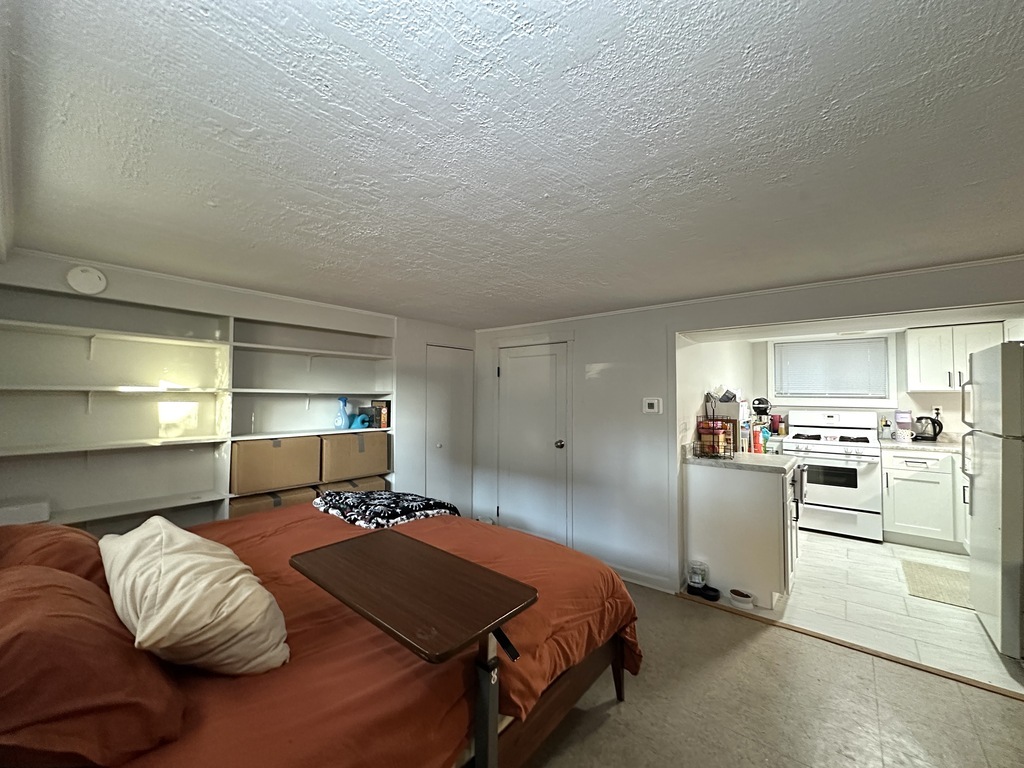 5701 North Keystone Avenue, Unit GDN Chicago, IL 60646 - Photo 16 of 20 a bed room with a bed and cabinets