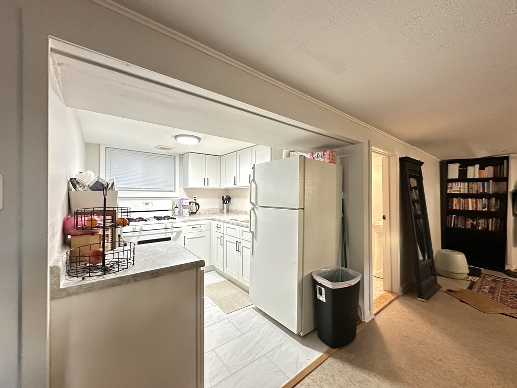 5701 North Keystone Avenue, Unit GDN Chicago, IL 60646 - Photo 4 of 20 a kitchen with stainless steel appliances a refrigerator and a stove