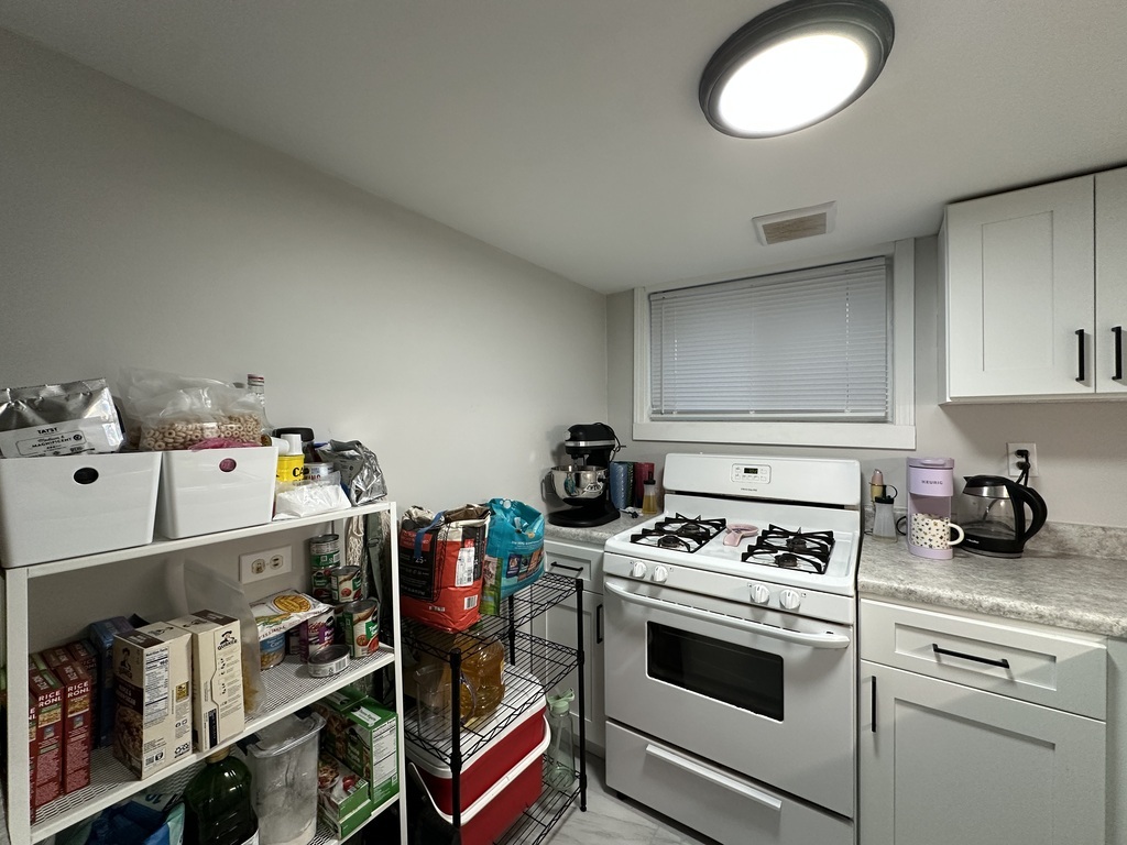 5701 North Keystone Avenue, Unit GDN Chicago, IL 60646 - Photo 7 of 20 a kitchen with stove and cabinets