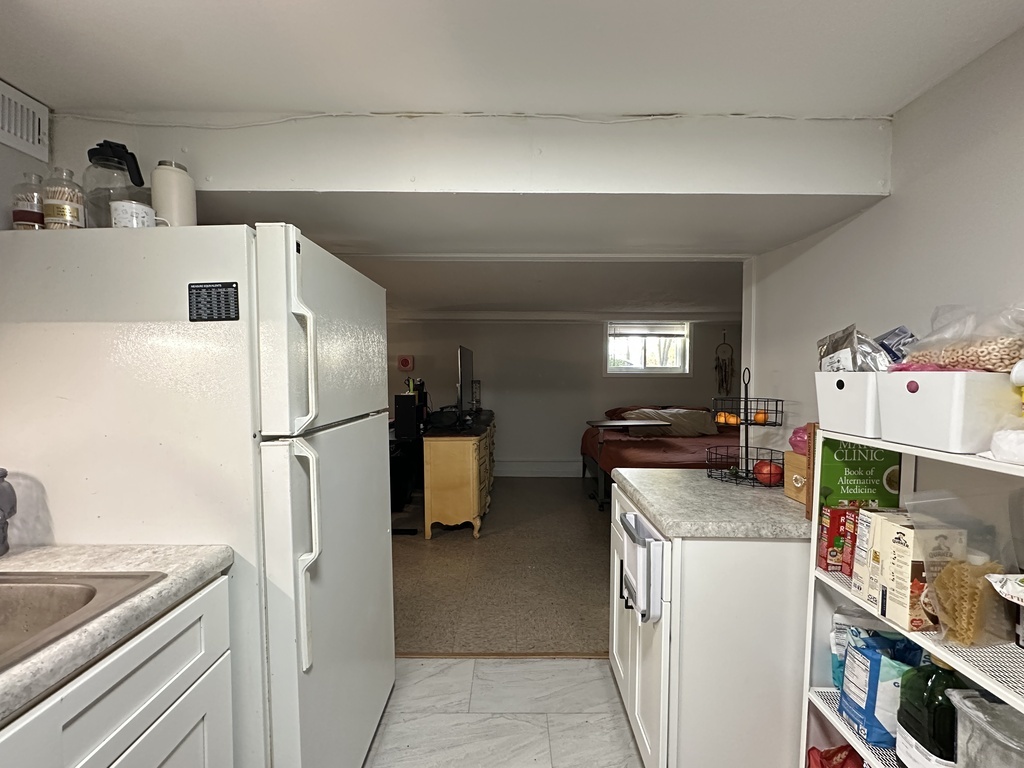 5701 North Keystone Avenue, Unit GDN Chicago, IL 60646 - Photo 10 of 20 a kitchen with refrigerator and car