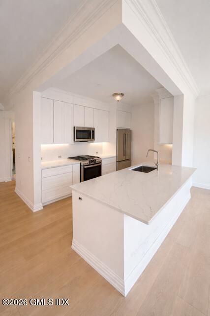 124 Ritch Avenue, Unit B301 Greenwich, CT 06830 - Photo 4 of 7 a large white kitchen with cabinets