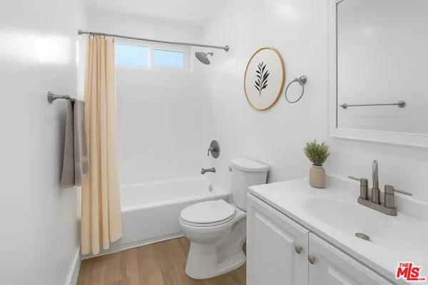 a bathroom with a toilet a sink and a bathtub