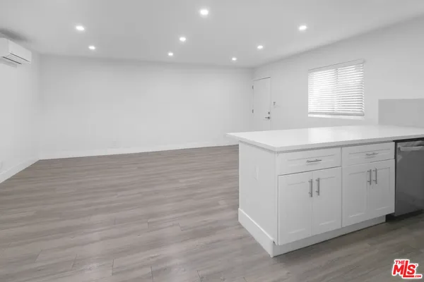 an empty room with wooden floor
