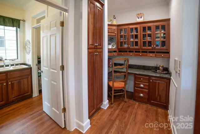 a kitchen with stainless steel appliances a refrigerator and a stove top oven