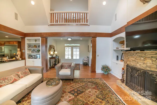 a living room with furniture and a fireplace
