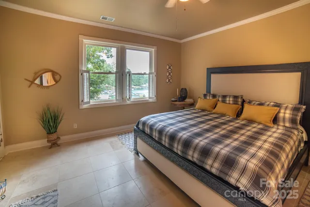 a bedroom with a bed and window