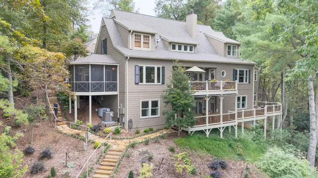 a front view of a house with a garden