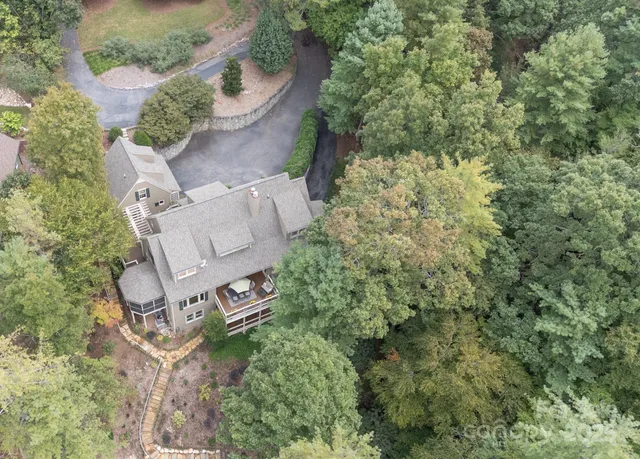 an aerial view of houses with yard