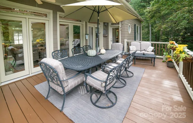 a view of a patio with furniture and wooden floor