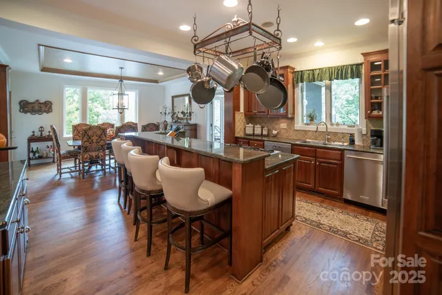 a kitchen with lots of counter space and dining table