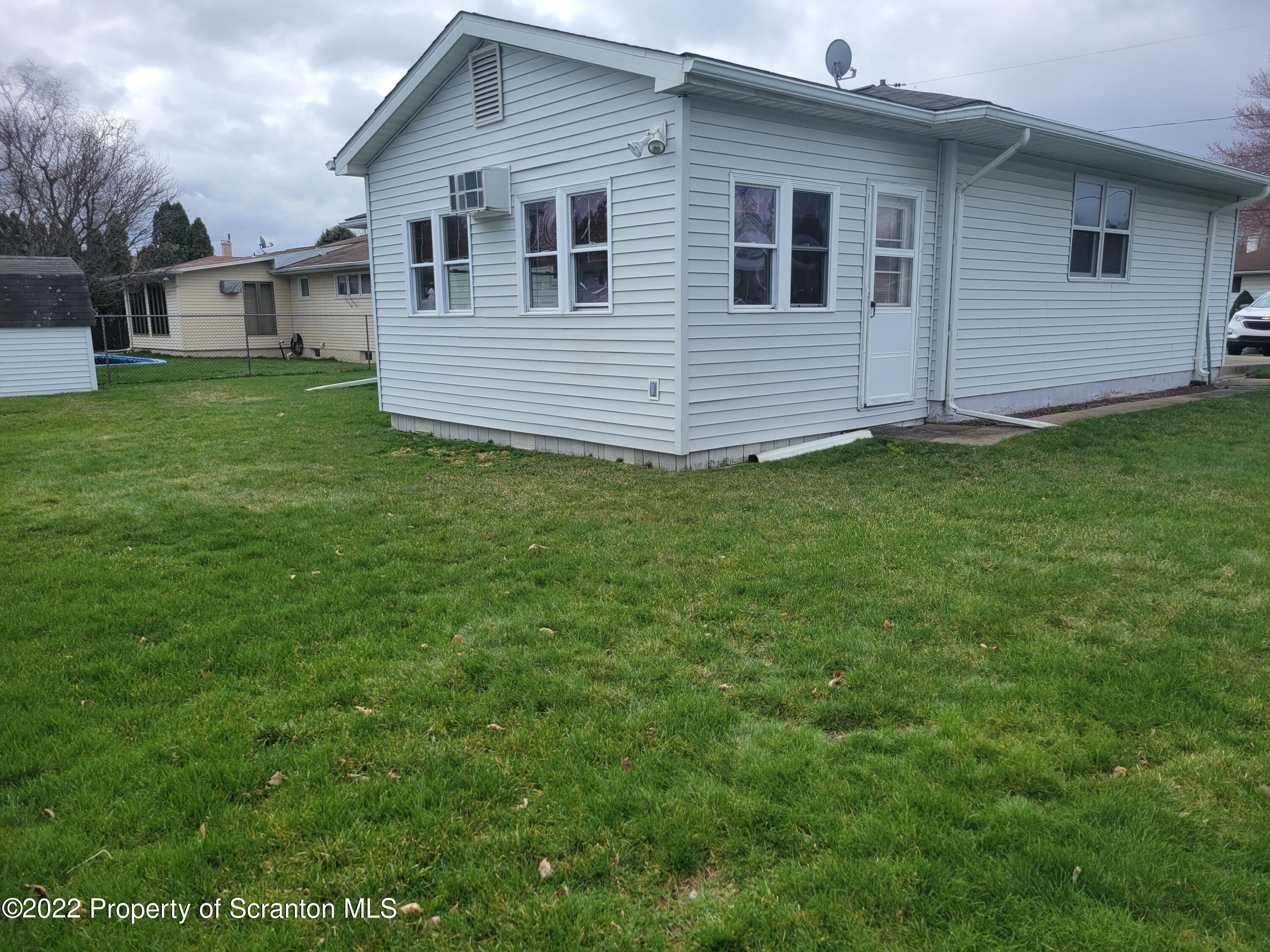 106 Billy Lane Taylor, PA 18517 - Photo 15 of 15 a front view of a house with a garden