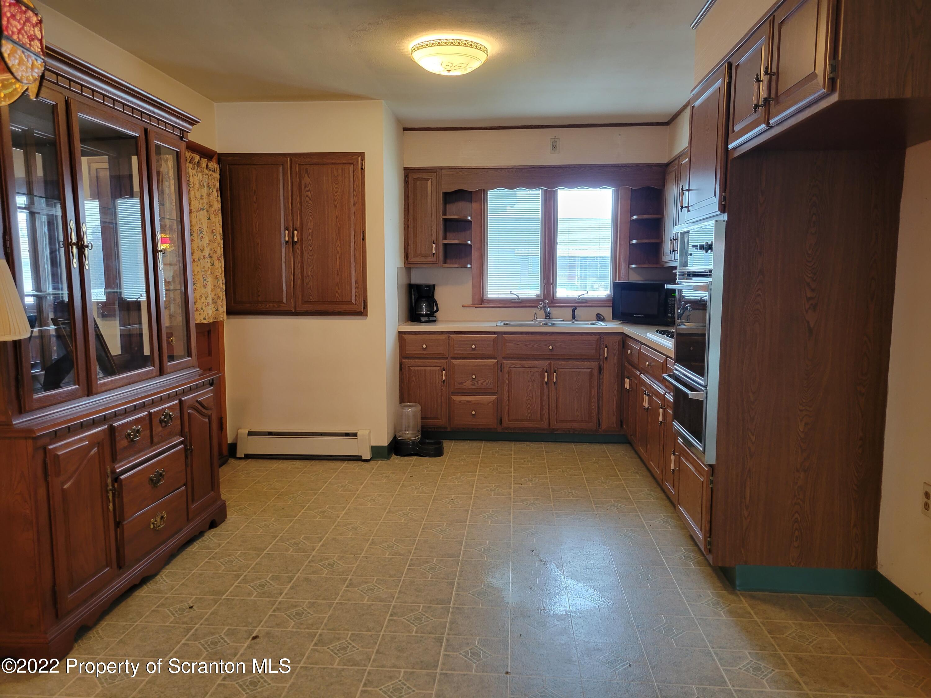106 Billy Lane Taylor, PA 18517 - Photo 3 of 15 a kitchen with stainless steel appliances granite countertop a refrigerator and a stove