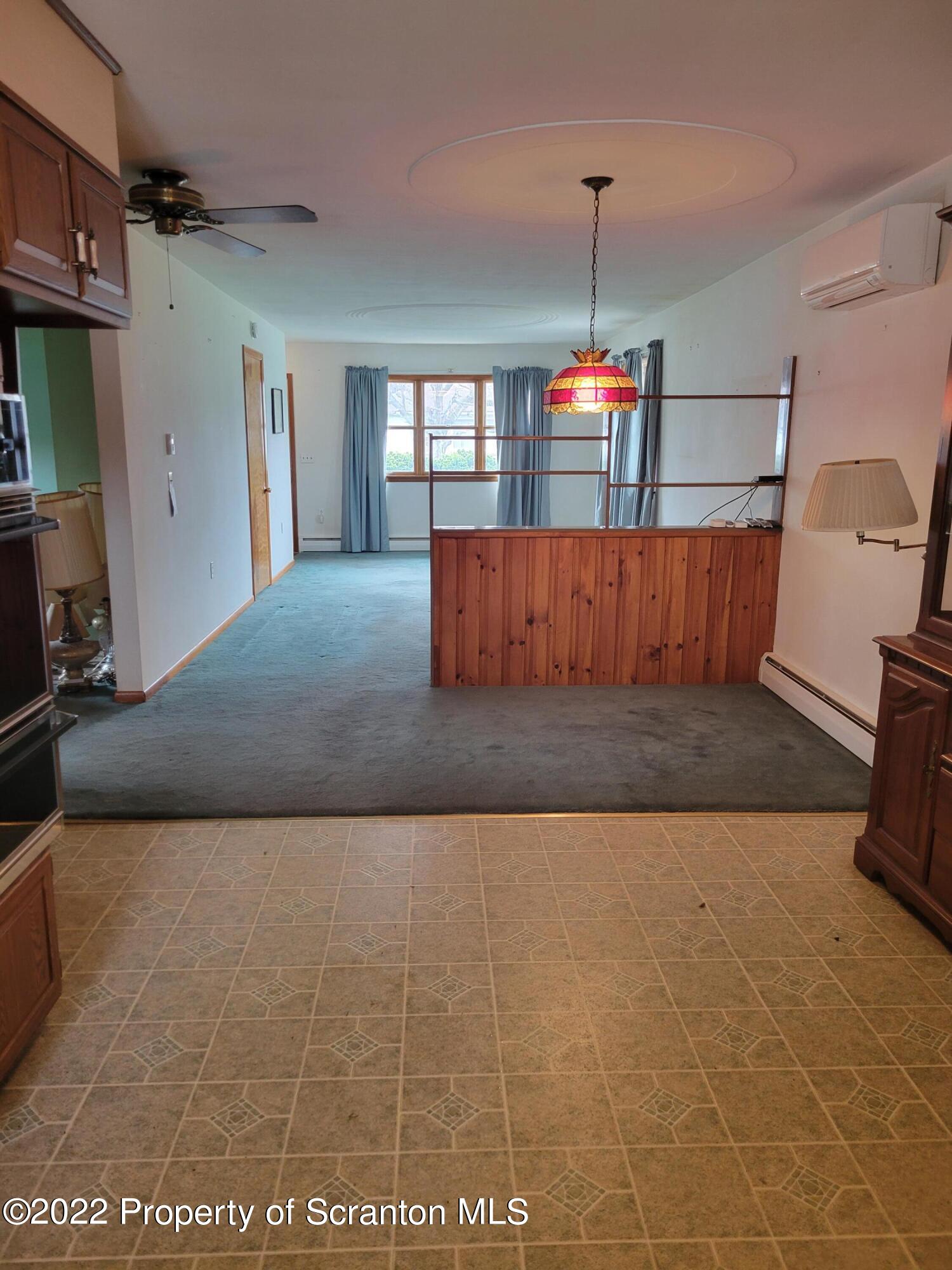 106 Billy Lane Taylor, PA 18517 - Photo 4 of 15 a living room with a couch and a flat screen tv